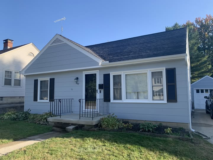 Freshly painted Cape Cod home exterior by Traditions in Springfield, Ohio